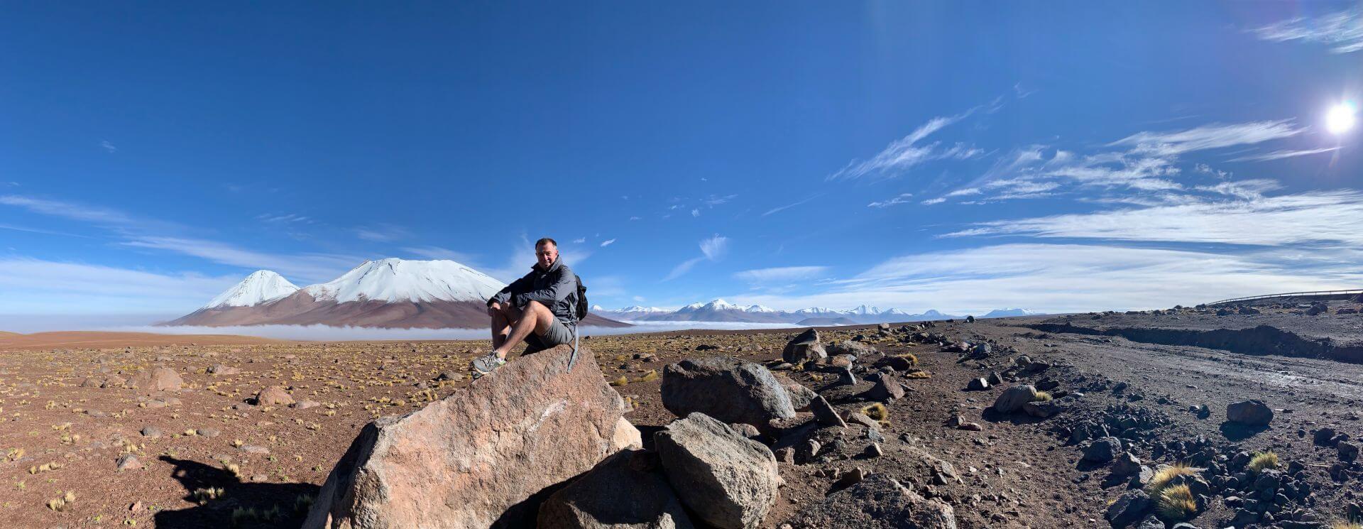 Climbing the red desert dunes of Namibia's Sossusvlei with Mars-like landscape