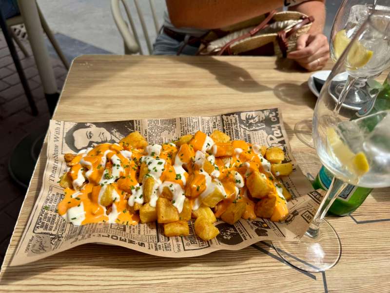 Eating pintxos in San Sebastian - For any British people, you'll feel validated to know they have patatas bravas!