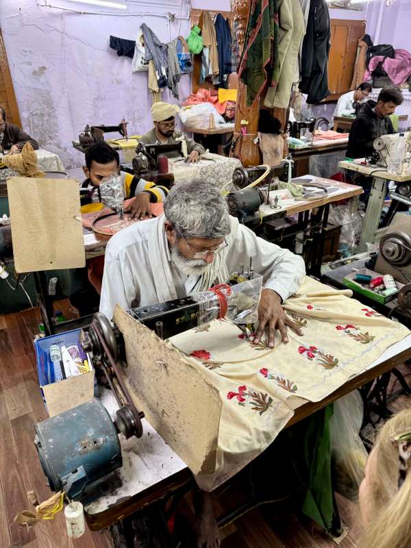 Visiting one of the small textile factories as part of a tour of Old Delhi