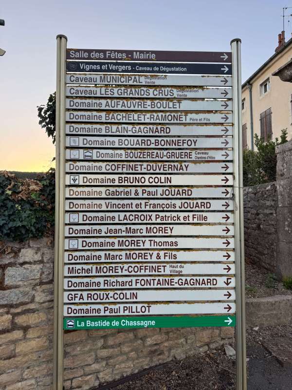 Cote de Beaune wine tasting - Chassagne-Montrachet village signpost listing its wine domaines