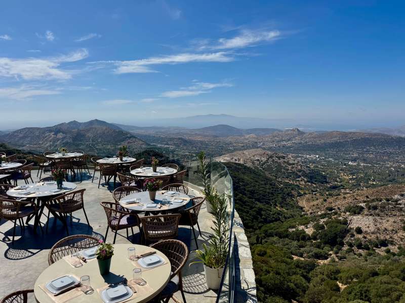 Restaurant terrace overlooking the hills and coastline of Naxos.