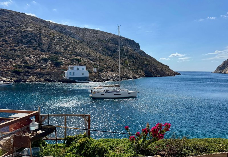 The 41-foot, three-cabin sailing yacht anchored in a sheltered Cyclades bay.